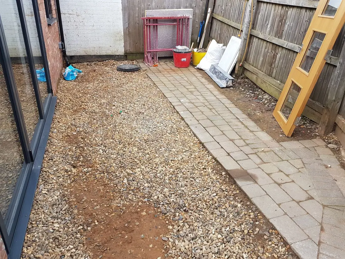 Gravel side yard before a new patio was laid