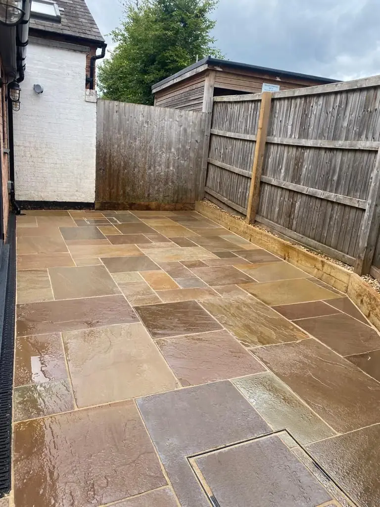 New sandstone patio laid in place of the gravel